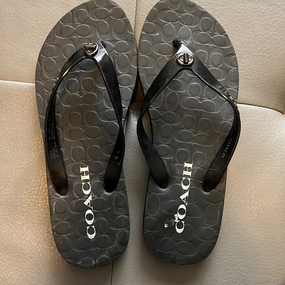 Black Coach flip flops size 5M. Very good condition.
